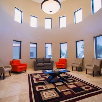 The round waiting room with tall windows